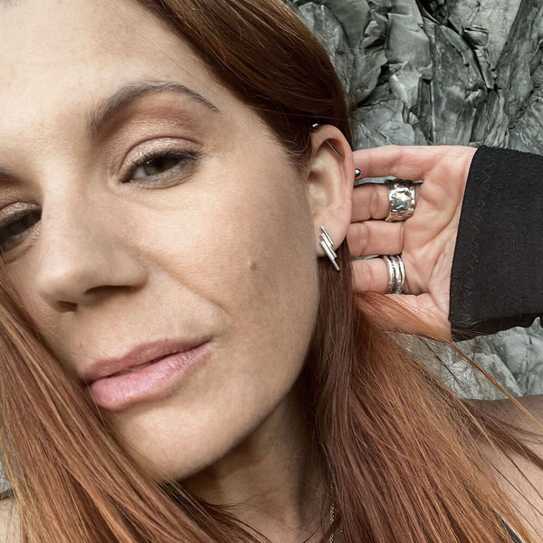 Basalt Stud Earrings in sterling silver with stepped column texture, inspired by Iceland. Handcrafted minimalist jewelry by Elke Van Dyke.