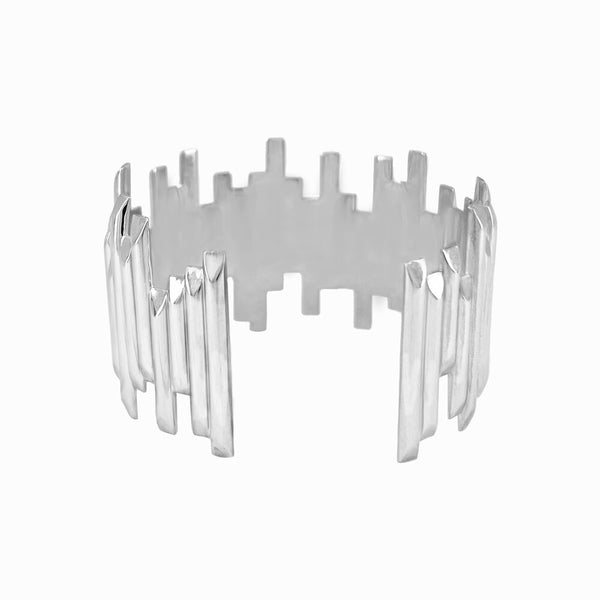 Wide Basalt Cuff Bracelet in sterling silver with offset design, inspired by Iceland’s Vik Beach and handcrafted by Elke Van Dyke. Front view.
