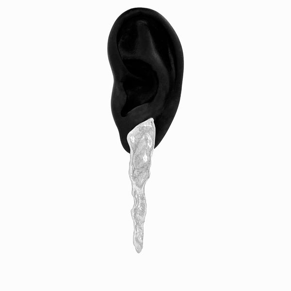 Long Glacier Triangle Earrings by Elke Van Dyke, handcrafted in sculpted sterling silver, inspired by glacial forms and minimalist, sculptural design. Shown on display ear.