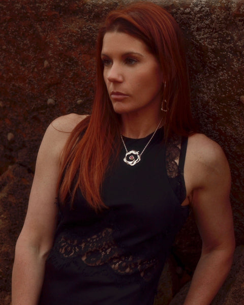 Nazare Necklace with blue topaz gemstone centerpiece, handcrafted in sterling silver by Elke Van Dyke. Inspired by the waves of Nazaré, Portugal.