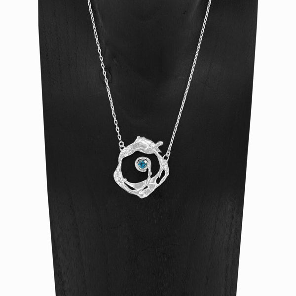Nazare Necklace with blue topaz gemstone centerpiece, handcrafted in sterling silver by Elke Van Dyke. Inspired by the waves of Nazaré, Portugal.