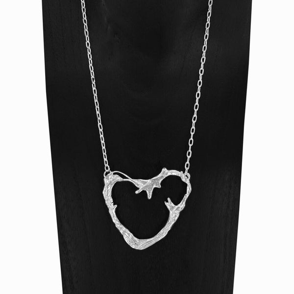 Handcrafted sterling silver Portugal Heart Necklace – elegant jewelry by Elke Van Dyke. Inspired by Portugal’s coastline.