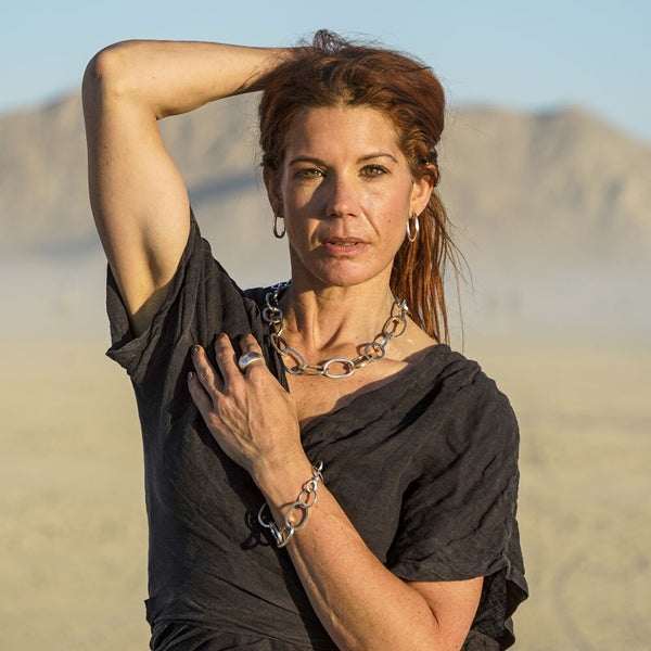 Sacred Bond earrings—handcrafted in polished sterling silver with bold sculptural chain-link design by Elke Van Dyke.