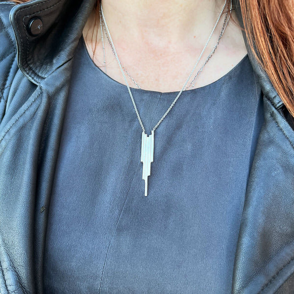 Basalt Necklace in sterling silver on mannequin neck. Handcrafted by Elke Van Dyke.
