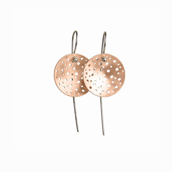 Gold Aristarchus Earrings by Elke Van Dyke – handcrafted 14K rose gold fill concave medallions with cratered textures, inspired by the moon's surface. Sterling Silver ear hooks.