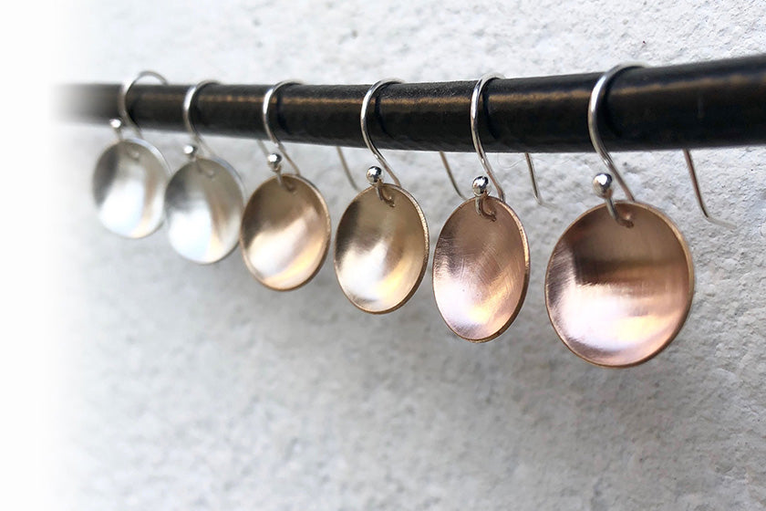Elke Van Dyke Design Small Moon Earrings hanging on wire