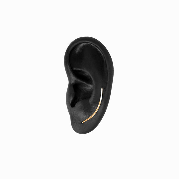 Elke Van Dyke Design image of the Ear Climber in Gold on mannequin ear
