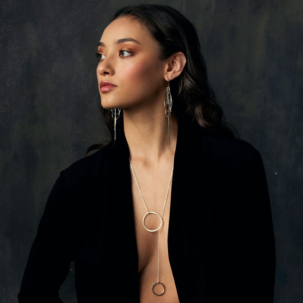 Gold Orbit Lariat Necklace crafted in 14k gold fill with a sculptural Y‑chain design. Lightweight elegance. Redefine your neckline now.