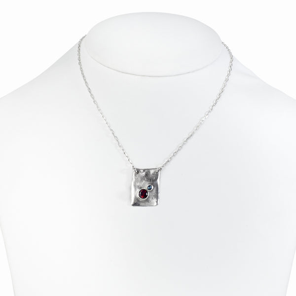 Handcrafted garnet and grey spinel necklace in sterling silver – unique artisan jewelry by Elke Van Dyke. One of a kind.