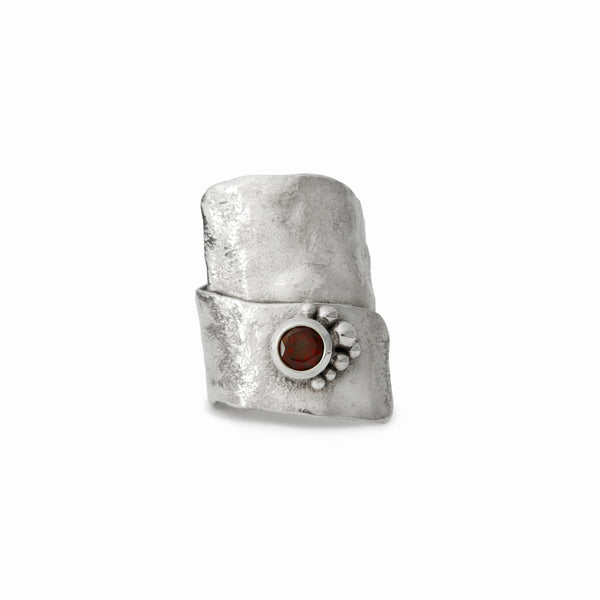 One-of-a-kind garnet ring from Elke Van Dyke’s Glacier Collection – handcrafted in sterling silver with raw sculptural texture and 6mm round faceted garnet.