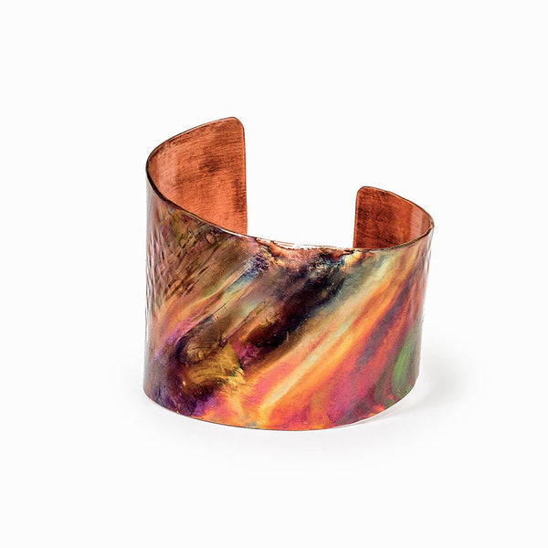 Asymmetrical Rainbow Copper Cuff Bracelet by Elke Van Dyke – flame-painted finish with hammered and smooth textures, handcrafted in copper.