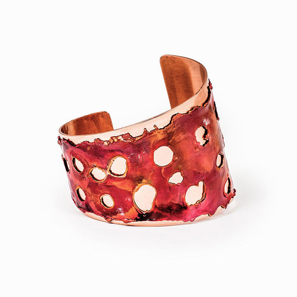 Blaze Asymmetrical Copper Cuff Bracelet with flame-textured finish, handcrafted by Elke Van Dyke, inspired by molten lava's organic forms.