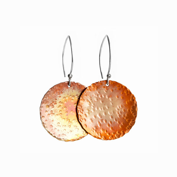 Large Copper Sol Earrings—handcrafted in copper and silver with turquoise patina. Sculptural and bold Seascape design by Elke Van Dyke.