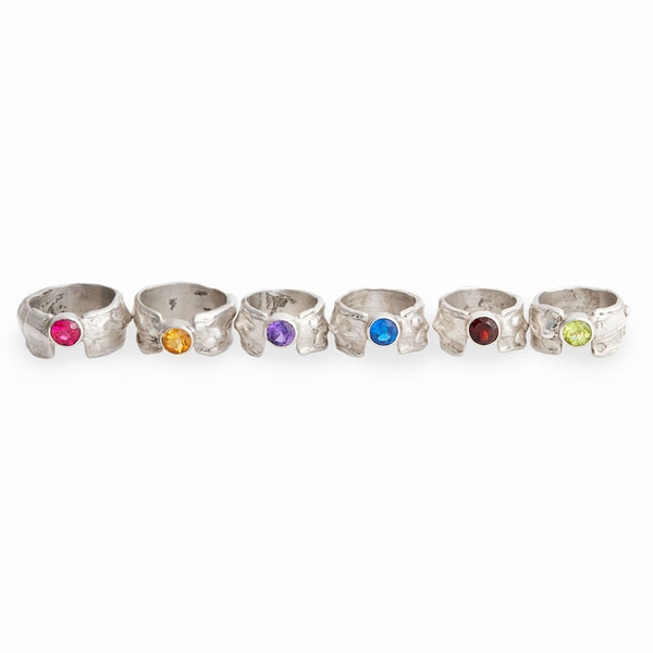 Elke Van Dyke Design Gemstone Waterfall Rings with Thin Bands sitting in a row, Handcrafted in sterling silver.