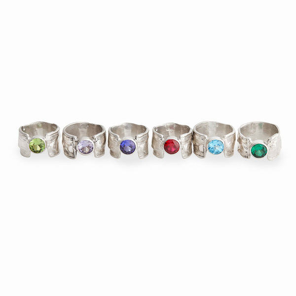 Elke Van Dyke Design Gemstone Waterfall Rings with Wide Bands sitting in a row, handcrafted in sterling silver.