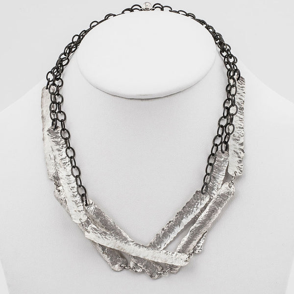 Elke Van Dyke Design Mirage Triple Strand Necklace on mannequin neck