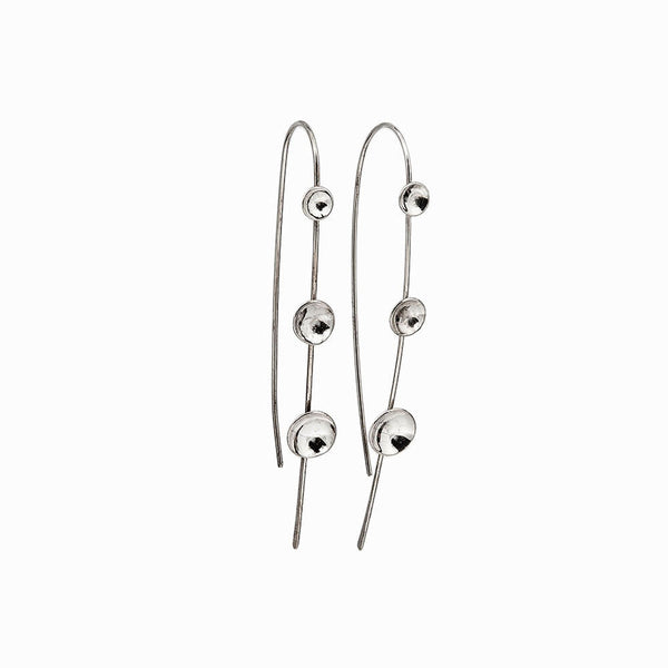 Moon Lapse earrings in sterling silver, a sculptural crescent shape handcrafted for lightweight celestial elegance by Elke Van Dyke.