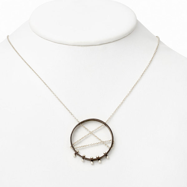 Moonscape pendant necklace—oxidized .925 silver, sleek sculptural form, modern moon-inspired elegance by Elke Van Dyke.