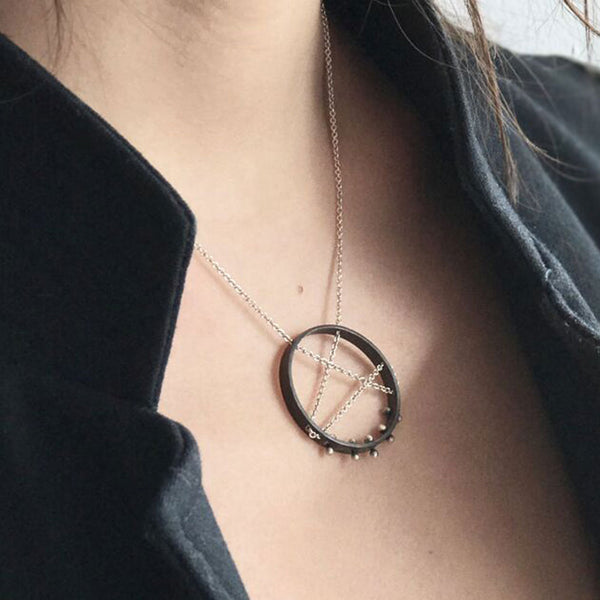 Moonscape pendant necklace—oxidized .925 silver, sleek sculptural form, modern moon-inspired elegance by Elke Van Dyke.