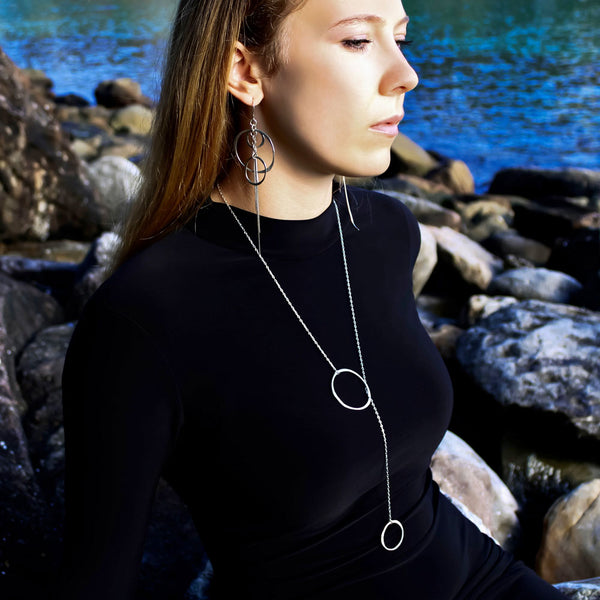 Orbit Lariat Necklace in sterling silver -cascading Y‑chain form, handcrafted for lightweight sculptural elegance by Elke Van Dyke.
