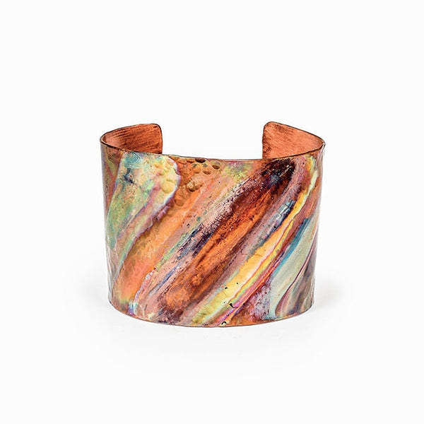 Rainbow Copper Cuff Bracelet with flame-painted finish, handcrafted by Elke van Dyke. Unique hues and textures create a bold, wearable art piece. 1.5" width.
