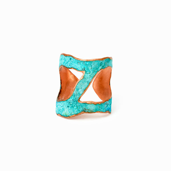 Rio Ring by Elke Van Dyke is adjustable copper band layered in turquoise patina with sculptural contouring. Handcrafted.