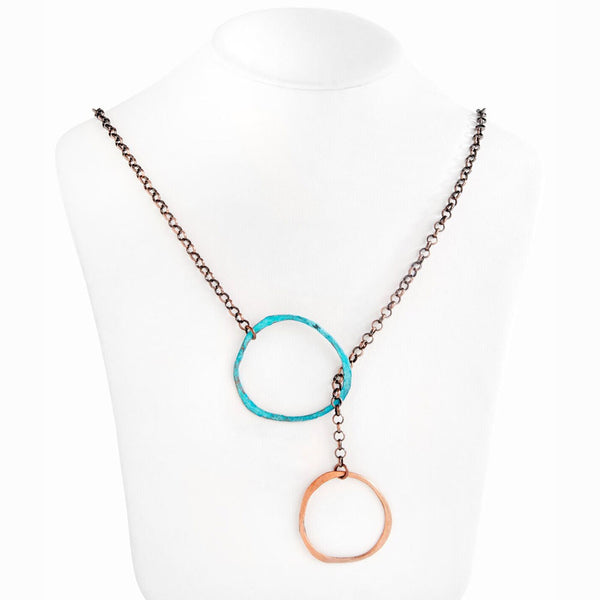 Sea Cirque Lariat by Elke Van Dyke Design– handcrafted flame-painted and turquoise patina copper halos with oxidized chain.