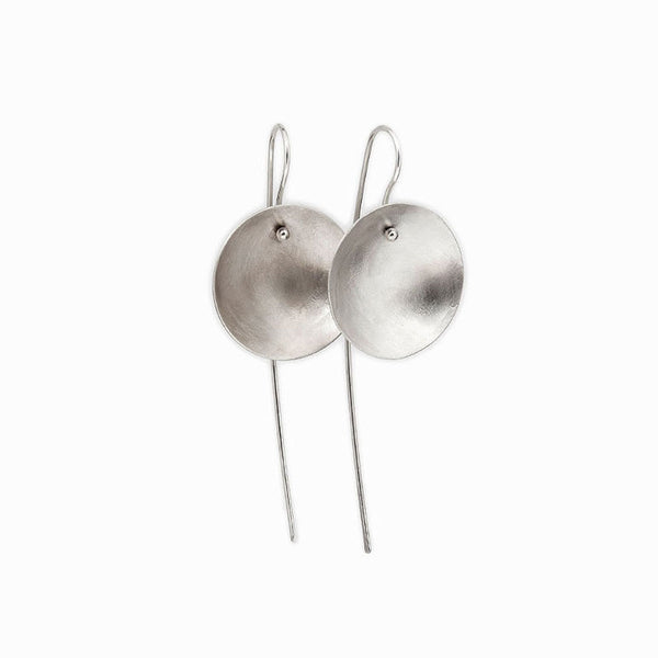 Handcrafted Silver Moon Earrings – minimalist lunar jewelry by Elke Van Dyke with celestial, organic elegance. Concave shape. Brushed finish.