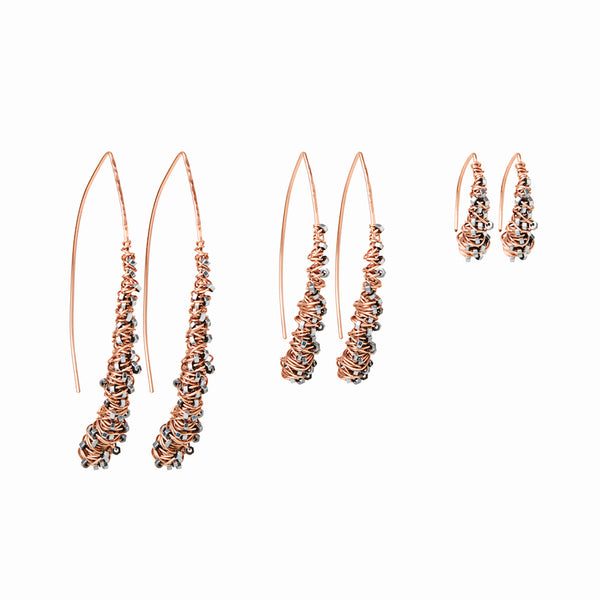 Rose Gold Cocoon Earrings by Elke Van Dyke. 14K rose gold fill & faceted hematite stones, organically spiraling into an elegant wishbone shape. Available in 3 sizes.