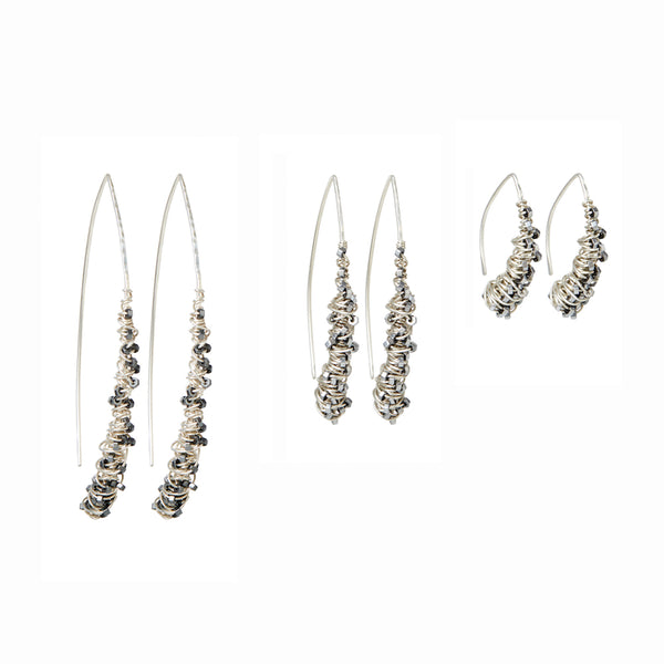 Silver Cocoon Threader Earrings handcrafted by Elke Van Dyke. Interwoven sterling silver and faceted hematite stones, organically spiraling into a wishbone shape. Available in 3 sizes.