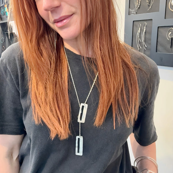 Core Lariat Necklace handcrafted in sterling silver with sculptural textured rectangular pendants by Elke Van Dyke Design.