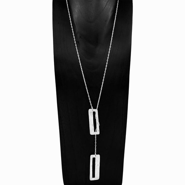Core Lariat Necklace handcrafted in sterling silver with sculptural textured rectangular pendants by Elke Van Dyke Design.