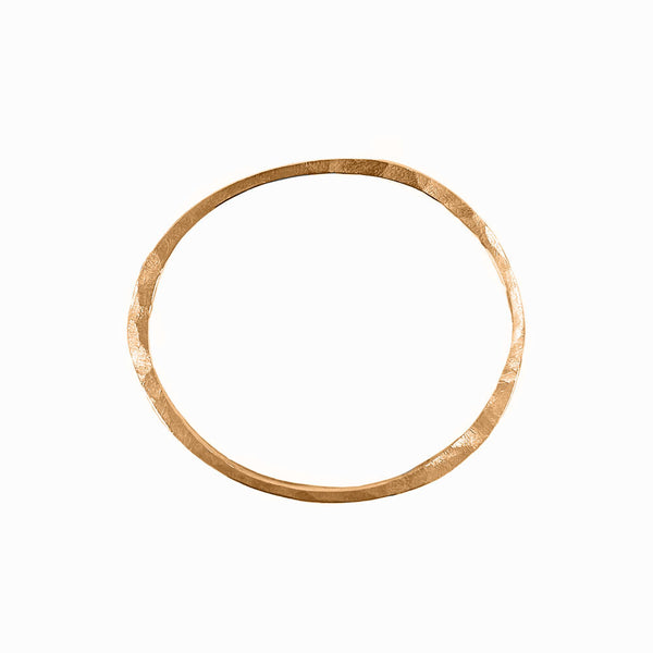 Gold Orbit bangle bracelet, sculptural and handcrafted for solo or stackable wear. By Elke Van Dyke.