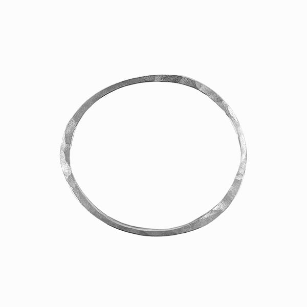 Sterling silver Orbit bangle bracelet -sculptural and hand-formed for everyday stacking or solo wear. Designed by Elke Van Dyke.