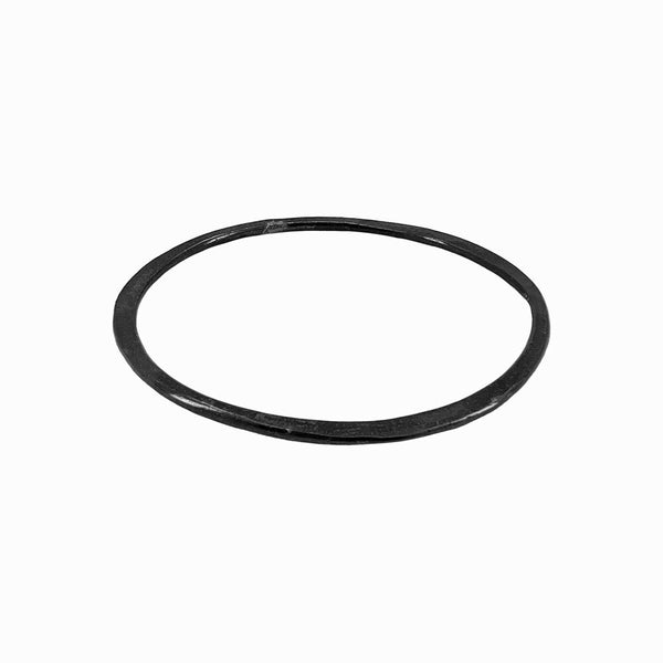 Oxidized Orbit bangle bracelet with hand-aged sculptural form in oxidized silver. Wear solo or stack. By Elke Van Dyke.