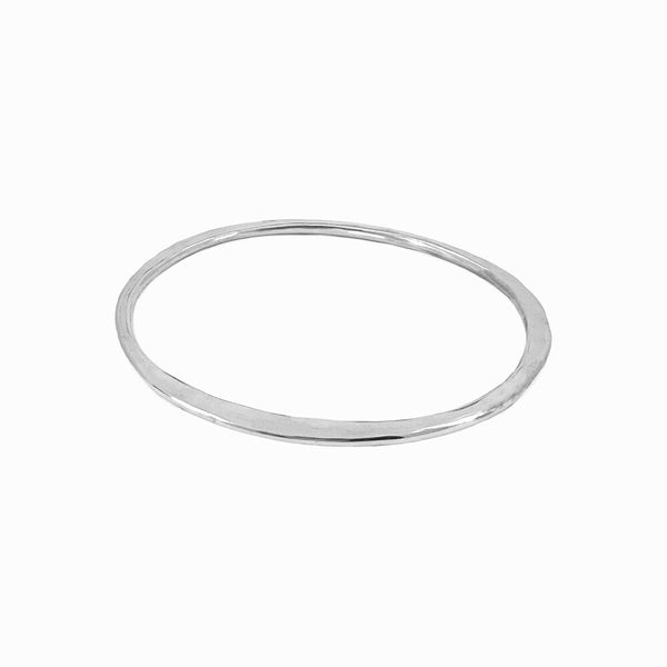 Sterling silver Orbit bangle bracelet -sculptural and hand-formed for everyday stacking or solo wear. Designed by Elke Van Dyke.