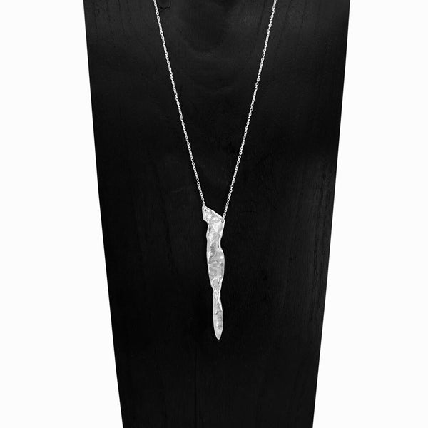 Glacier Triangle Necklace, a hand-sculpted sterling silver pendant, one-of-a-kind geometric form inspired by ice and fire, by Elke Van Dyke.