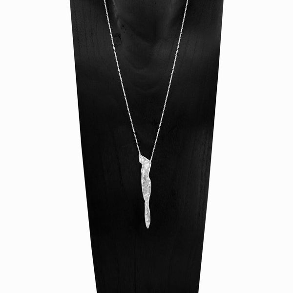 Glacier Triangle Necklace, a hand-sculpted sterling silver pendant, one-of-a-kind geometric form inspired by ice and fire, by Elke Van Dyke.