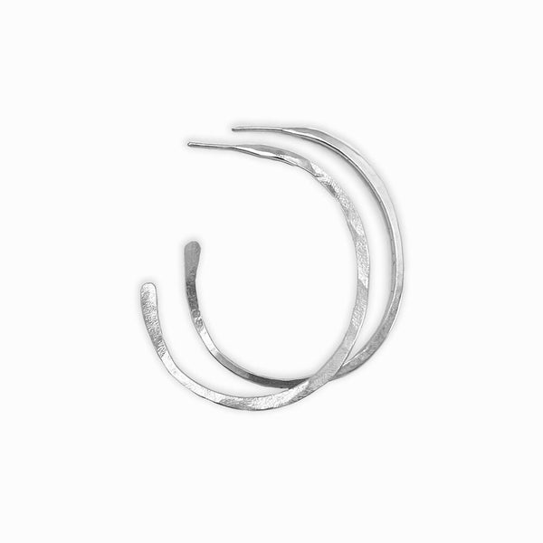 Orbit Hoop Earrings by Elke van Dyke - sterling silver sculptural hoops with undulating form. Lightweight wearable art.