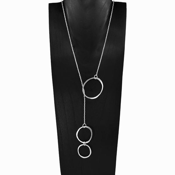 Trio Orbit Lariat Necklace in sterling silver sculptural Y-chain with three silver circles, lightweight and radiant by Elke Van Dyke.