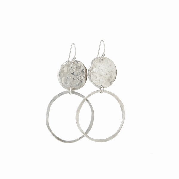 Solo Orbit Earrings in sterling silver. A sculptural hoop form, handcrafted for lightweight elegance and everyday impact by Elke Van Dyke.