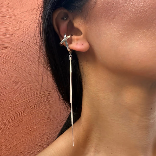 X-Nova Ear Cuff—sculptural sterling silver cuff with long cascading chain and celestial sheen. Statement wearable art by Elke Van Dyke.