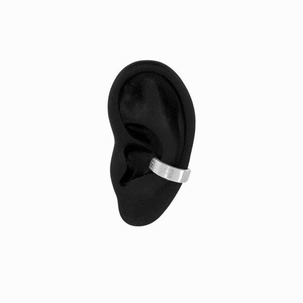 Silver Core Ear Cuff on a black ear against a white background. Unisex statement jewelry from Elke Van Dyke.