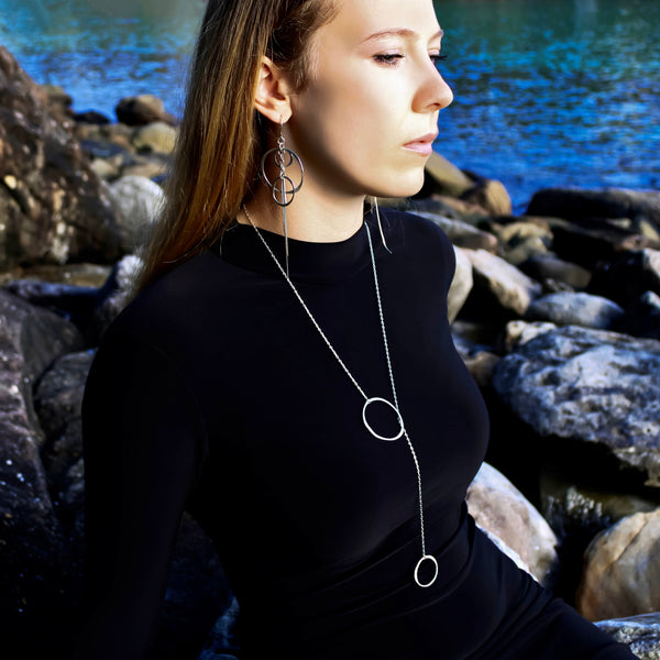 Orbit Lariat Necklace in sterling silver -cascading Y‑chain form, handcrafted for lightweight sculptural elegance by Elke Van Dyke.