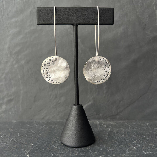 Silver Moon Dust Drop Earrings by Elke Van Dyke – handcrafted sterling silver with high polish finish, inspired by organic lunar textures.