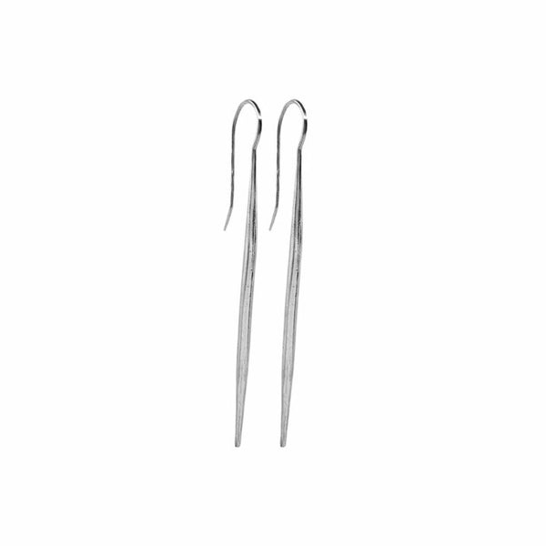 Icicle Earrings—handcrafted sterling silver sculptural drop earrings with sleek winter-light shine by Elke Van Dyke.