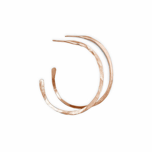 Rose Gold Orbit Hoop Earrings by Elke Van Dyke are 14K gold fill sculptural hoops with undulating form. Available in 3 sizes.