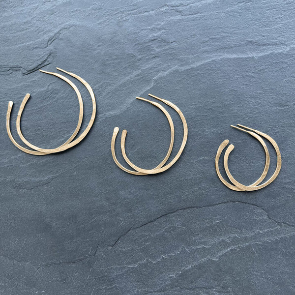 Gold Orbit Hoop Earrings by Elke Van Dyke are 14K gold fill sculptural hoops with undulating form. Available in 3 sizes.
