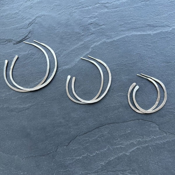 Orbit Hoop Earrings by Elke van Dyke - sterling silver sculptural hoops with undulating form. Lightweight wearable art.