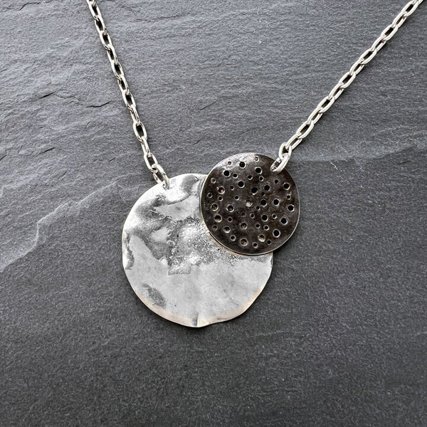 Retroshade Necklace by Elke Van Dyke – handcrafted sterling silver with luminous crescent and oxidized moon design.